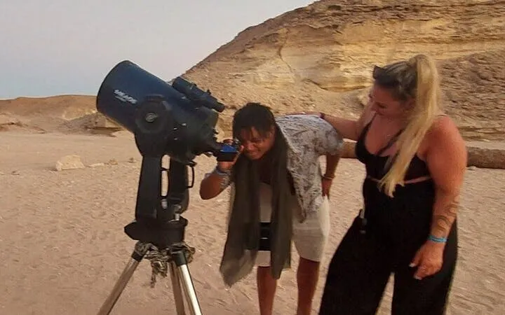 Stargazing with telescope in Sharm El Sheikh desert during Bedouin dinner experience.