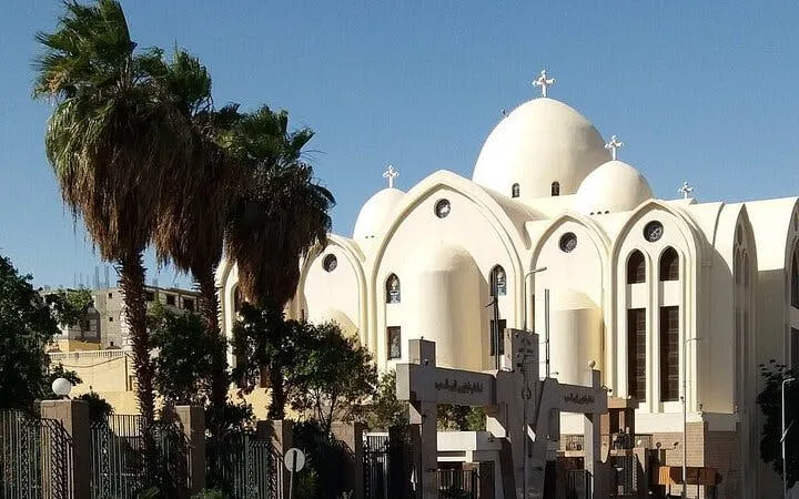Mosque with domes and palm trees in Sharm El Sheikh during a private city tour.