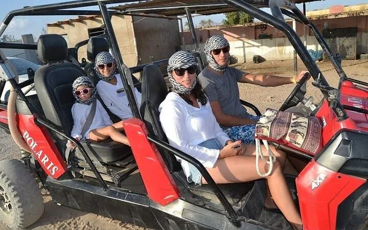 Family in buggy car on desert safari, Sharm El Sheikh.