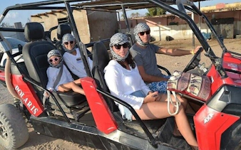 Family in buggy car on desert safari, Sharm El Sheikh.