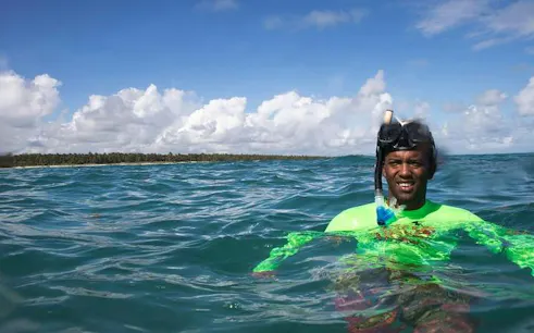 Snorkeler enjoying clear waters on a catamaran cruise in Punta Cana.