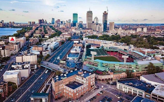 Boston skyline with Fenway Park and Charles River in view.