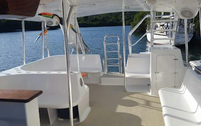 Catamaran deck with seating and ocean view, Punta Cana cruise.