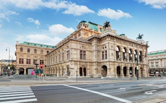 Vienna State Opera building on a clear day, part of the self-guided city exploration game.