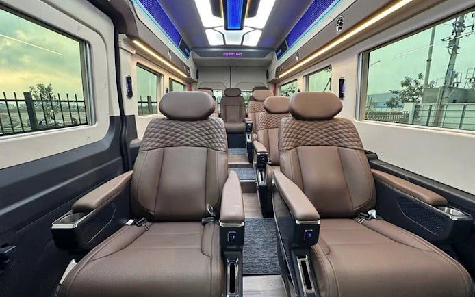 Interior of a luxury van for private transfer between Sapa and Ninh Binh, featuring comfortable seating.