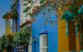 Colorful colonial buildings with flowers in Cartagena Walled City.