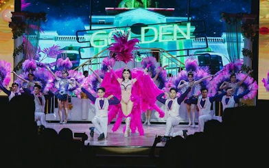 Golden Dome Cabaret performers in vibrant costumes on stage, Bangkok.
