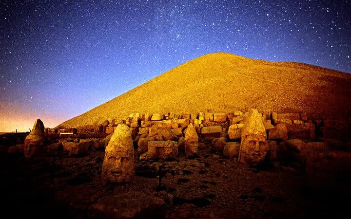 Mount Nemrut stone heads under a starry night sky in Cappadocia, Turkey.