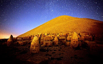 Mount Nemrut stone heads under a starry night sky in Cappadocia, Turkey.