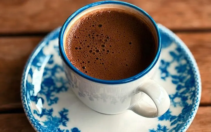 Greek coffee served in a traditional cup on a patterned saucer in Athens.