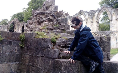 Person exploring ruins at York, part of Harry Potter Locations Interactive Walking Tour.