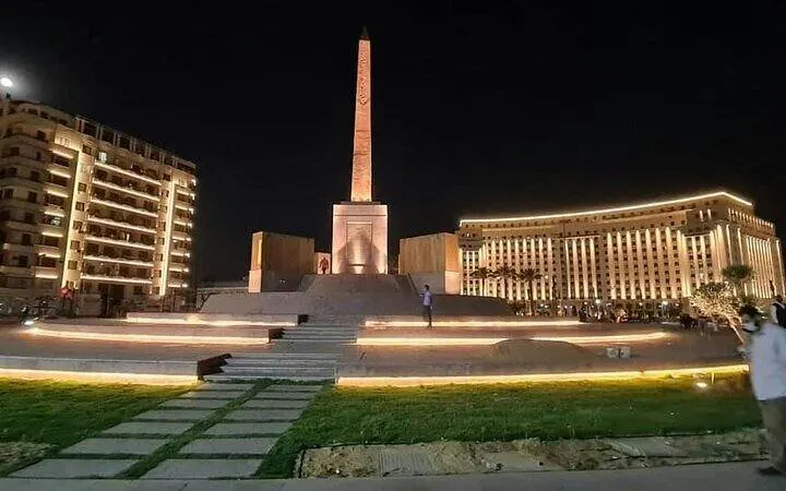 Obelisk at Tahrir Square, Cairo, illuminated at night, part of Cairo Over Day tour.