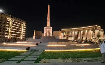 Obelisk at Tahrir Square, Cairo, illuminated at night, part of Cairo Over Day tour.