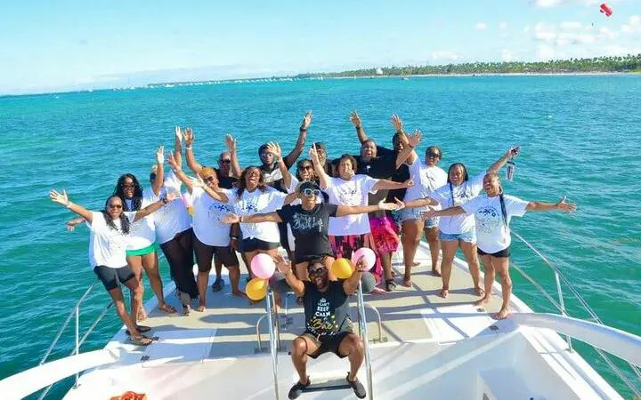 Group enjoying a party boat cruise on turquoise waters, Punta Cana.