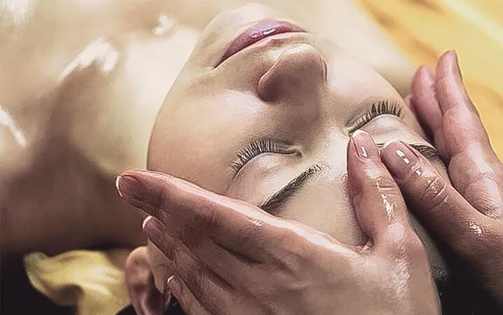 Person receiving a facial massage during Turkish bath in Sharm El Sheikh.