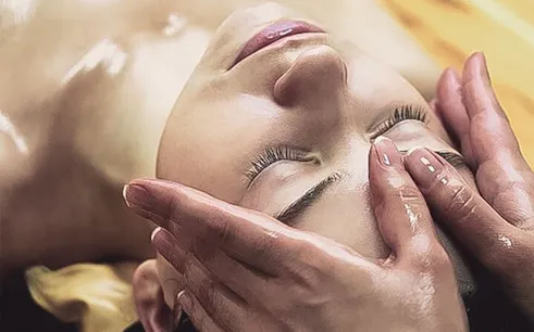 Person receiving a facial massage during Turkish bath in Sharm El Sheikh.