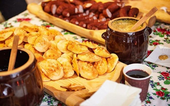 Cheese tasting spread with traditional Polish oscypek and sausages in Zakopane.