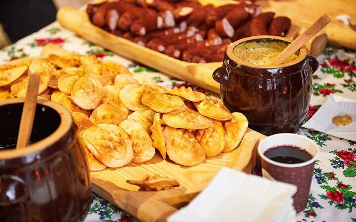 Cheese tasting spread with traditional Polish oscypek and sausages in Zakopane.