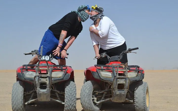 Couple on quad bikes during desert safari in Sharm El Sheikh.