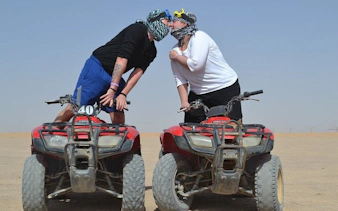 Couple on quad bikes during desert safari in Sharm El Sheikh.