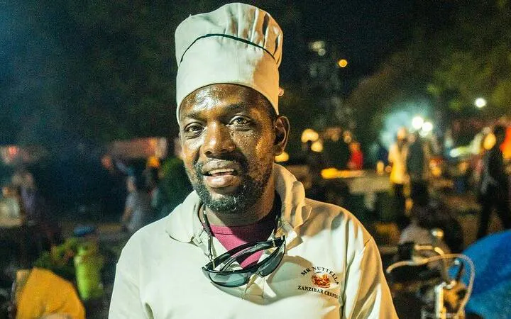 Chef at Stone Town Zanzibar Night Food Market during walking tour.