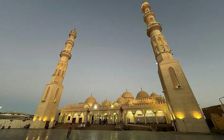 Mosque with tall minarets at dusk, part of a private guided tour in Hurghada.