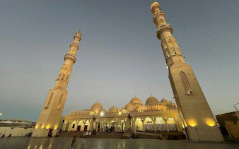 Mosque with tall minarets at dusk, part of a private guided tour in Hurghada.