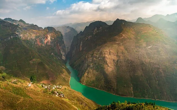 Ha Giang Loop view with river winding through mountains, Vietnam.