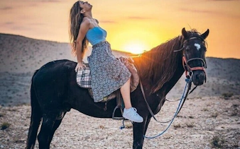 Horseback riding at sunset on Red Sea beach, Hurghada desert tour.