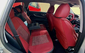 Interior of a car with red seat covers for Cairo and Giza private airport or hotel transfer.
