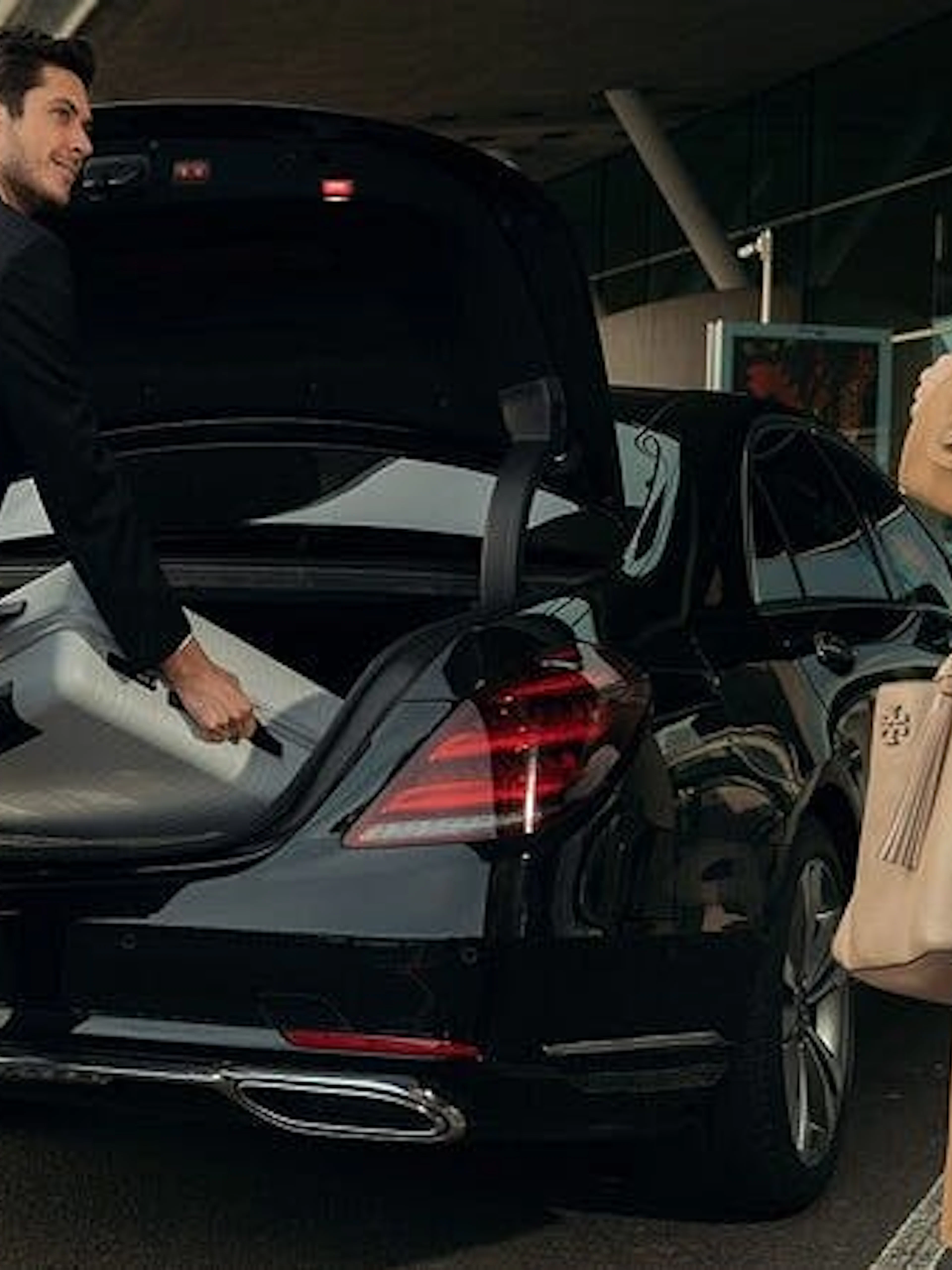 Driver loading luggage into car trunk for Agadir from Marrakesh private transfer.