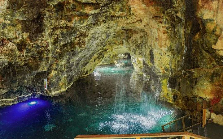 Cenote cave with clear water and rock formations at Taino Park, Punta Cana.