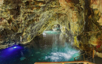 Cenote cave with clear water and rock formations at Taino Park, Punta Cana.
