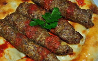 Grilled kebabs on flatbread, Turkish cuisine tour in Eastern Turkey.