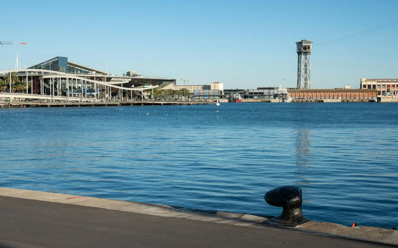 Barcelona Port Vell with Maremagnum shopping center and cable car tower in the background.