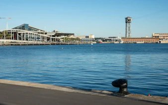 Barcelona Port Vell with Maremagnum shopping center and cable car tower in the background.