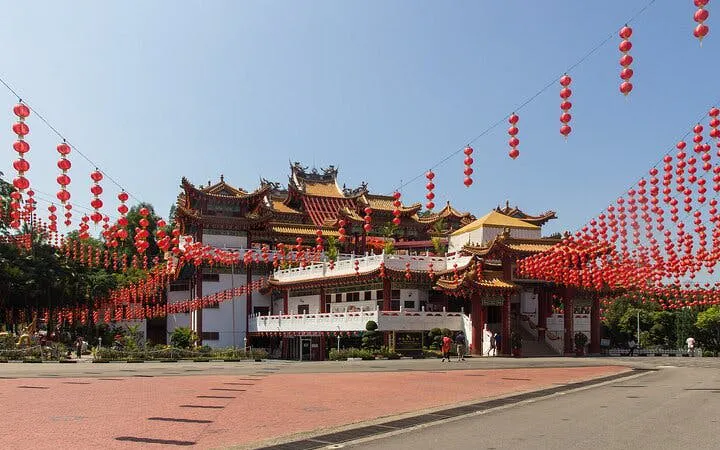 Buddhist temple with red lanterns in Kuala Lumpur, part of Batu Caves and religious landmarks tour.
