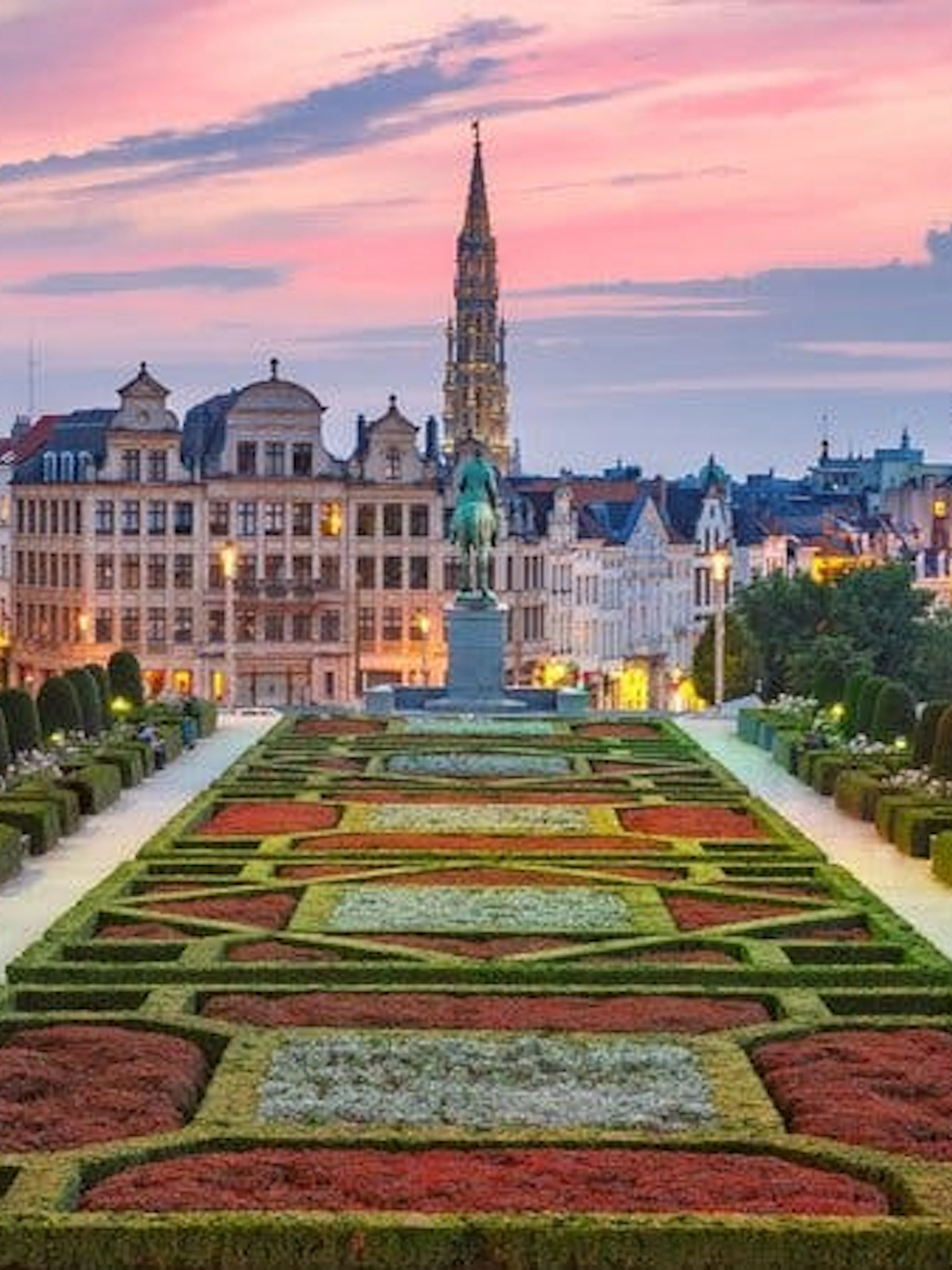Mont des Arts garden with Brussels skyline at sunset during self-guided walking tour.