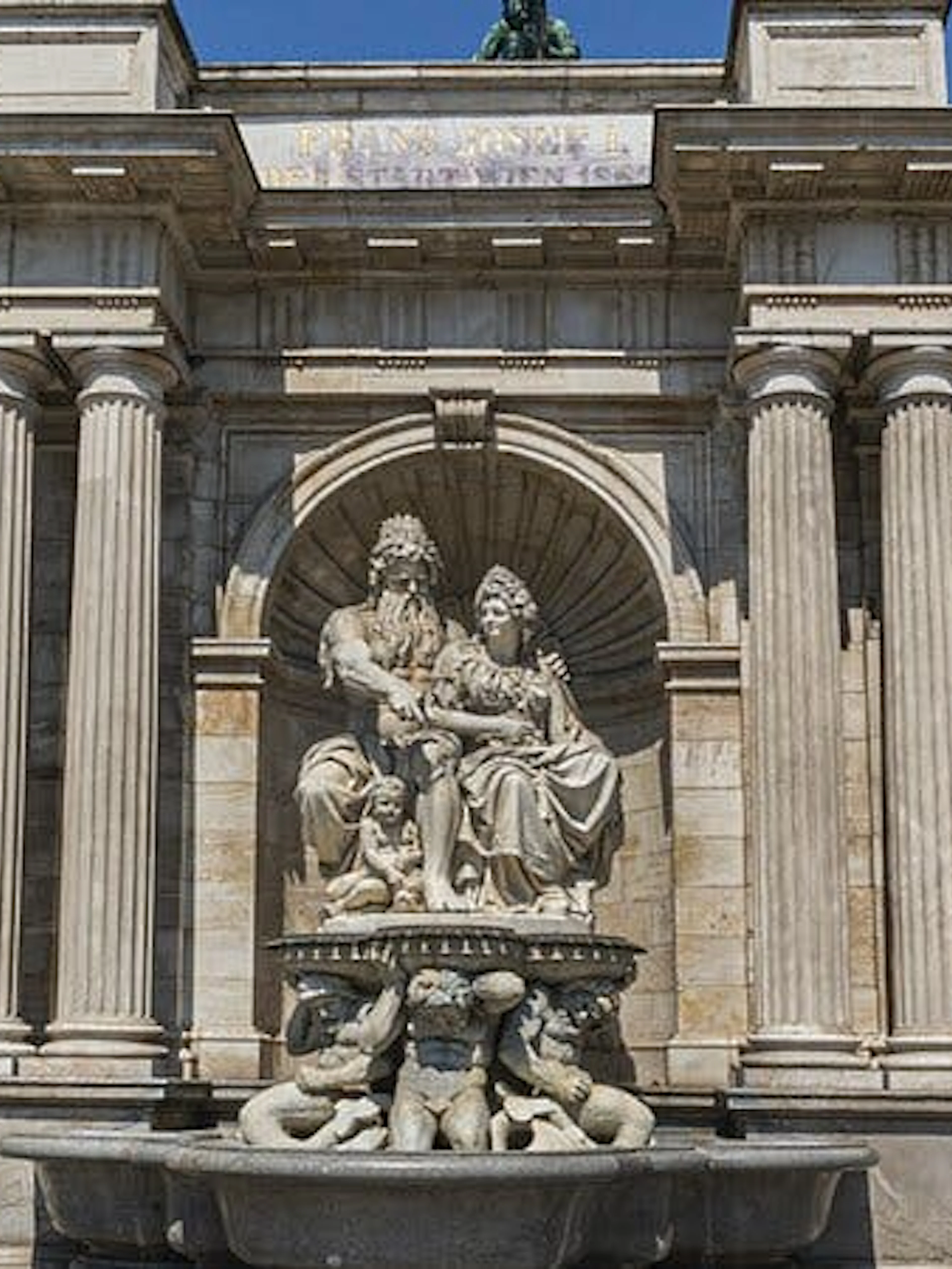 Vienna architectural landmark with statues, part of self-guided city exploration game.