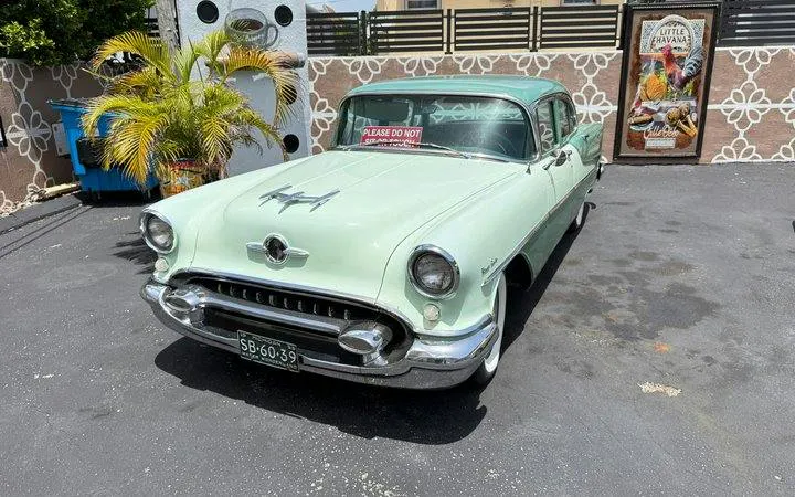 Classic car parked in Little Havana, Miami, near Calle Ocho tour landmarks.
