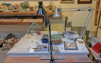 Artisan workshop table with tools and materials for hands-on activities in Florence.
