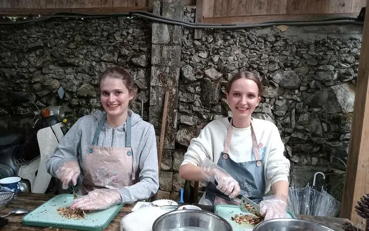 Participants chopping ingredients at a Pho noodle soup cooking class.