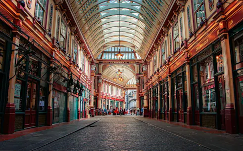 Leadenhall Market interior with arched roof and shops, part of City of London audio walk.