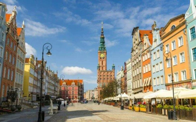 Long Market street with colorful buildings and Gdansk Town Hall on a self-guided audio walking tour in Gdansk.