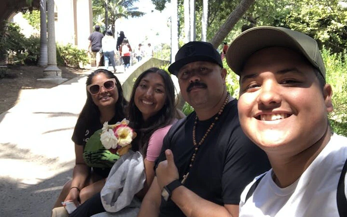 Group enjoying a sunny day at Balboa Park, San Diego, during a self-guided city exploration game.