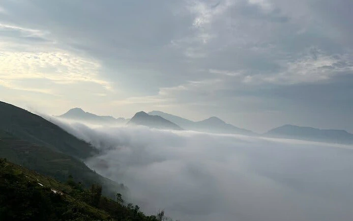 Foggy mountain landscape in Sapa, Vietnam, viewed during a motorbike tour of Ta Phin and Ban Khoang villages.