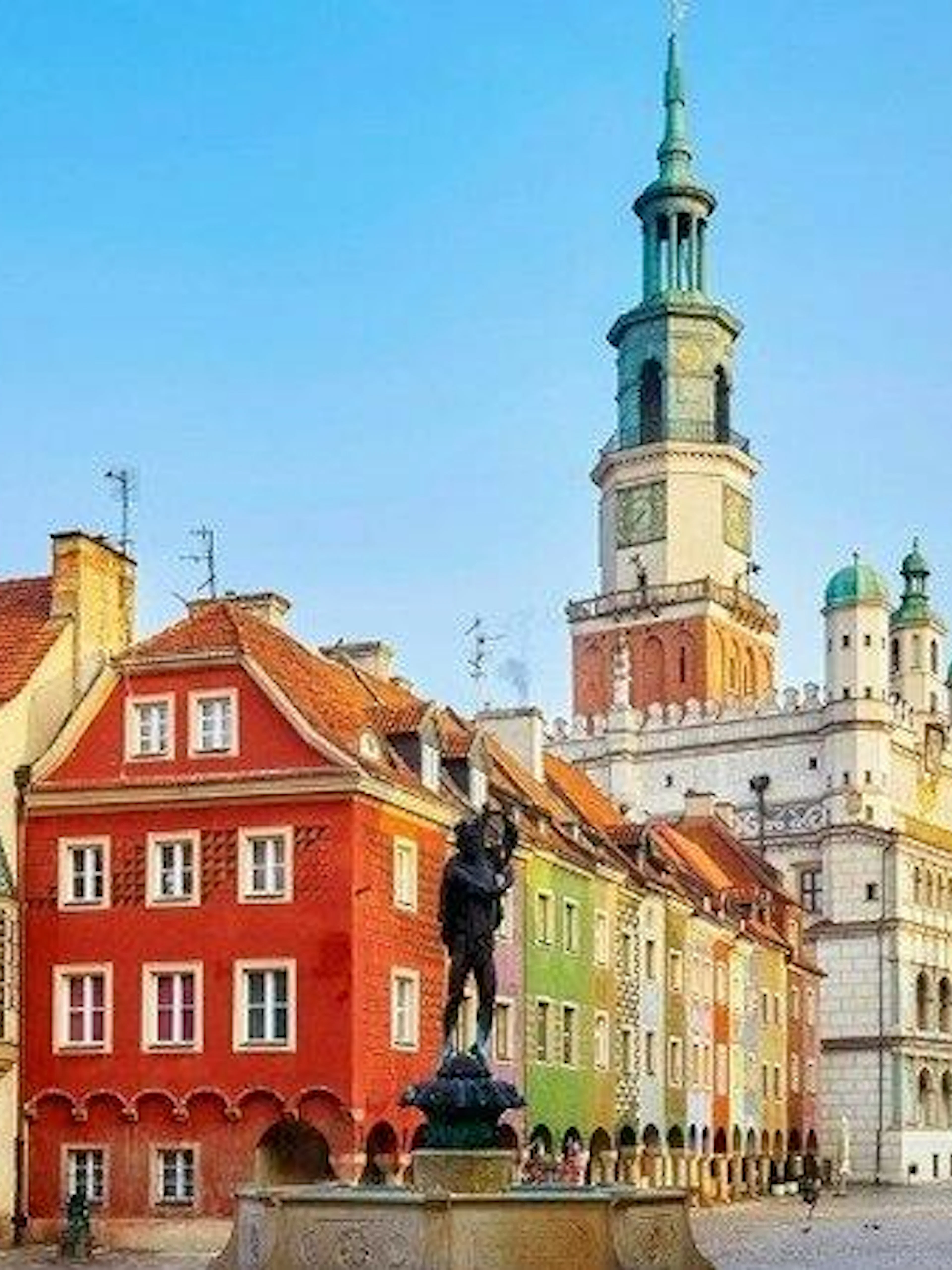 Colorful buildings and town hall in Poznan's Old Market Square, featured in a self-guided audio tour.