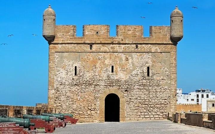 Essaouira fortress with cannons along the wall, part of Marrakech coastal tour.