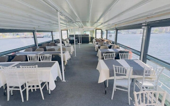 Ferry interior with dining tables set for Princess Islands Heybeliada and Buyukada round-trip.