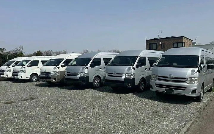 Private transfer vans parked for Fukuoka Airport to Fukuoka City service.